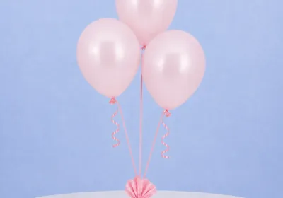 Set of 3 pink balloons with sticks and cups, ideal for birthdays and baby showers, adding a joyful touch to celebrations.