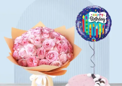 Pink roses with cakes and balloon