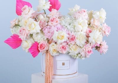 Luxury flower box featuring white hydrangeas, pink ohara roses, and dry leaves