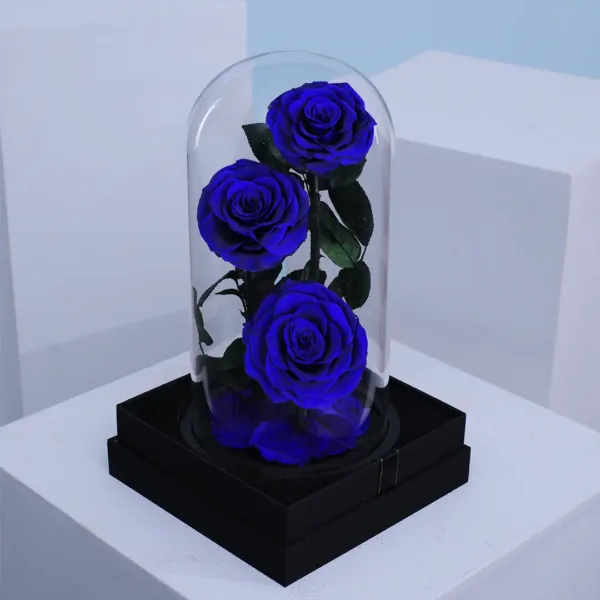 Trio of preserved red roses in dome