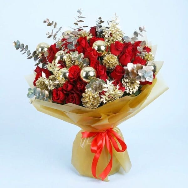 01 Christmas bouquet with red roses, gold pinecones, golden ornaments, and with festive wrapping