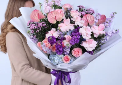 Celestial Garden Mixed Bouquet featuring pink roses, matthiola, hydrangea, anthurium, and baby roses arranged in a soft pastel floral design