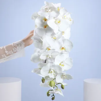 Classic Ivory Wedding Blooms featuring white phalaenopsis orchids arranged for elegant wedding ceremonies and reception décor