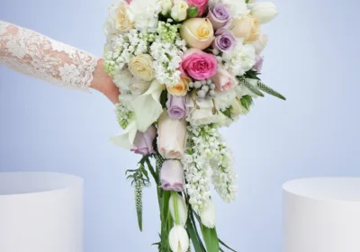 Dreamy Pastel Romance Bouquet featuring tulips, calla lilies, roses, lisianthus, veronica, brunia, and matthiola in soft pastel bridal styling