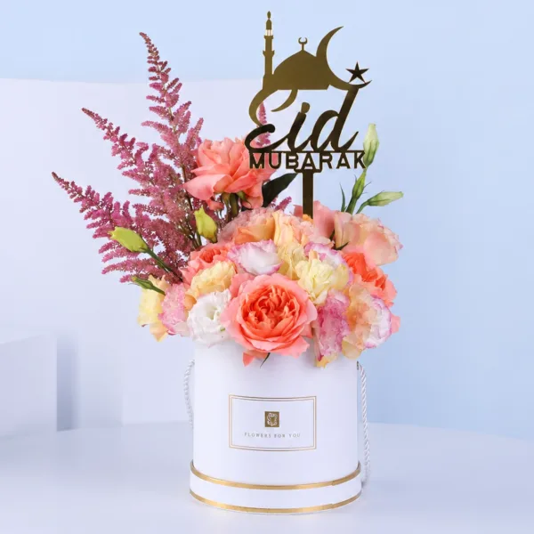 elegant-eid-bloom-box Elegant Eid Bloom Box featuring pink and peach roses with pink astilbe arranged in a white box with an Eid Mubarak topper for festive gifting