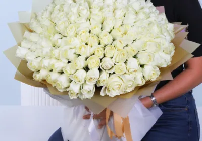 Luxury White Rose Bouquet featuring 100 premium white roses arranged in a grand elegant bouquet for gifting and special occasions