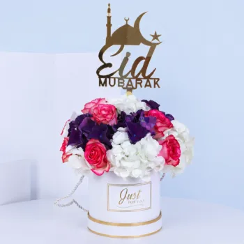 Premium Eid Floral Arrangement featuring dual-tone roses and white and dark purple hydrangeas arranged in a personalized Eid Mubarak gift box