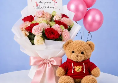 Birthday Bouquet Teddy Combo featuring a bouquet of fresh roses and carnations paired with a 40cm red jacket teddy bear for birthdays and special celebrations.