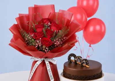 Chocolate Cake Rose Bouquet Combo featuring 7 red roses, gypsophila, lepidium, 3 balloons, and a rich chocolate ganache cake for celebrations and gifting.