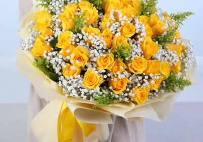 50 Yellow Rose Bouquet featuring 50 fresh yellow roses arranged with delicate gypsophila and lush solidaster leaves, creating a vibrant floral bouquet perfect for celebrations, birthdays, congratulations, and gifting.