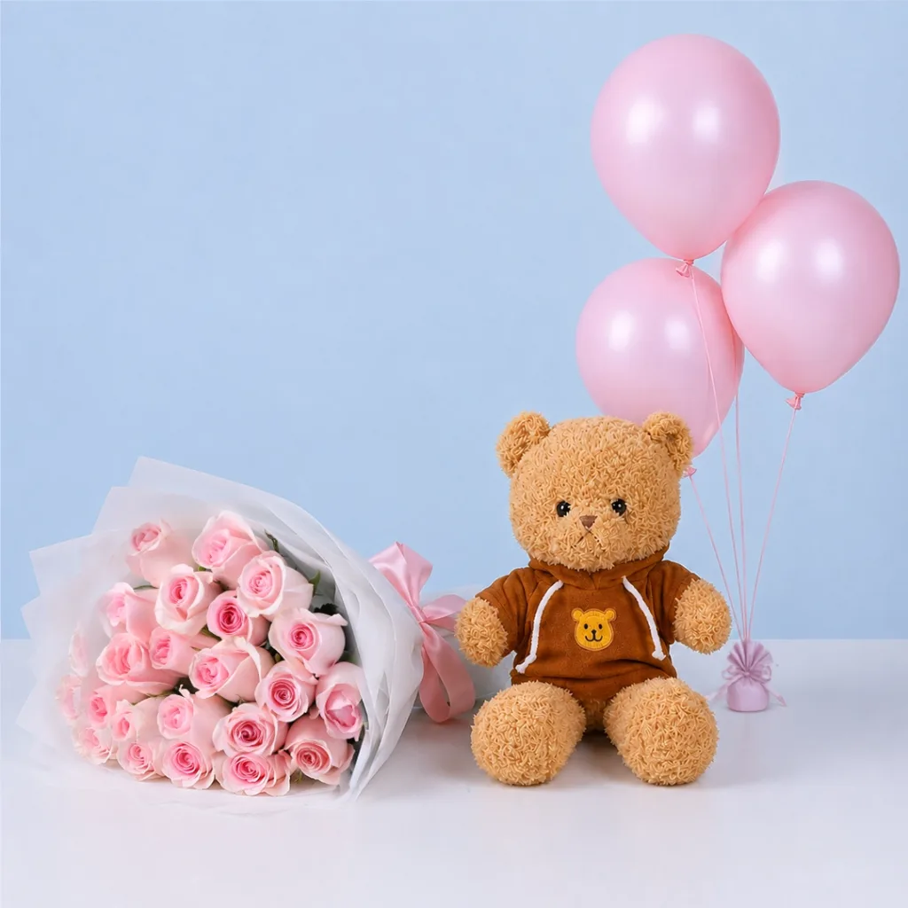 Birthday Rose Teddy Combo featuring light pink Titanic roses, a brown hoodie teddy bear, pink balloons, and premium floral wrapping for birthday gifting.