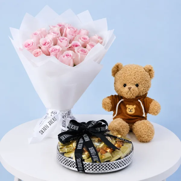 pink-roses-chocolate-teddy-combo Pink Roses, Chocolate & Teddy Combo featuring fresh light pink roses, an 800g assorted chocolate tray, and a 40cm brown teddy bear.