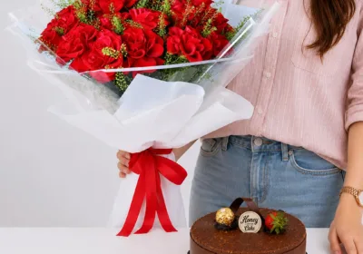 Red Roses Bouquet & Ferrero Cake featuring 20 fresh red roses with greenery and a rich 1kg Ferrero Rocher chocolate cake for gifting and celebrations in Qatar.