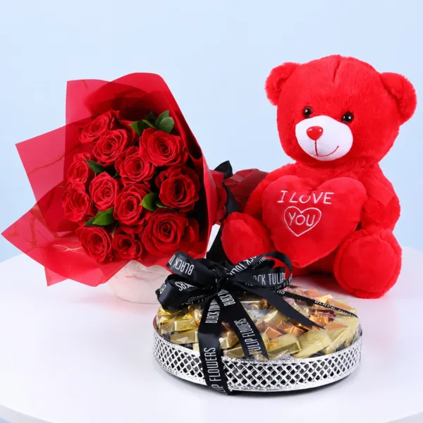 red-roses-chocolate-teddy-combo Red Roses, Chocolate & Teddy Combo featuring a bouquet of fresh red roses, an 800g assorted chocolate tray, and a red teddy bear.