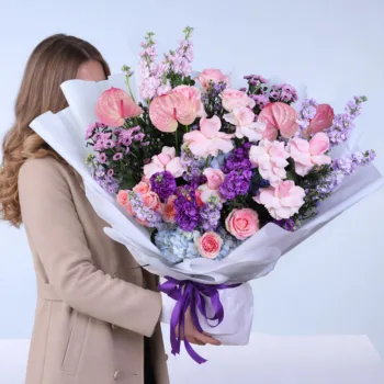 Celestial Garden Mixed Bouquet featuring pink roses, matthiola, hydrangea, anthurium, and baby roses arranged in a soft pastel floral design