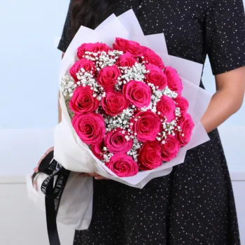 Deep Pink Floral Bouquet featuring 12 pink roses and gypsophila arranged in a rich and elegant floral design for gifting and celebrations