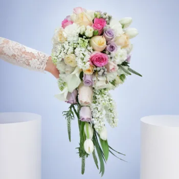 Dreamy Pastel Romance Bouquet featuring tulips, calla lilies, roses, lisianthus, veronica, brunia, and matthiola in soft pastel bridal styling